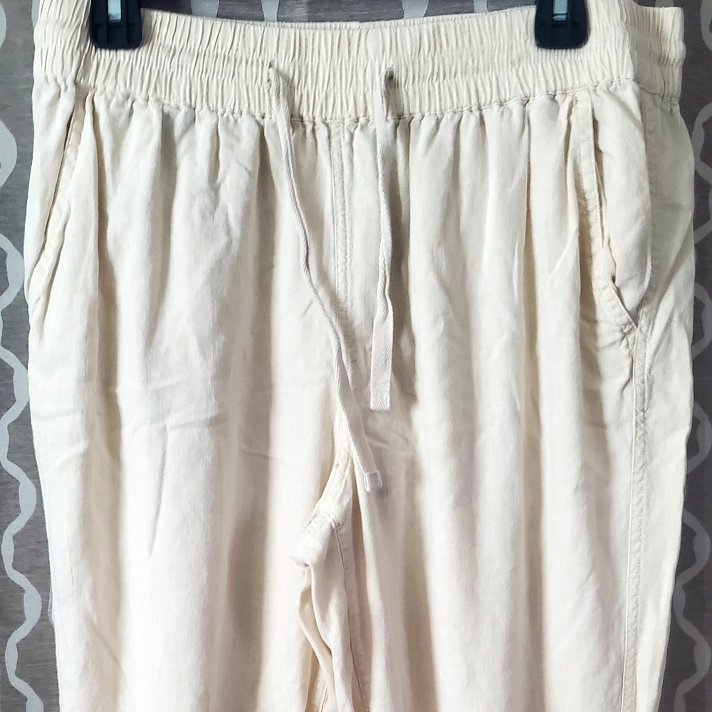 Wonderly joggers, lightweight material, tie waste, light pink color, size large.